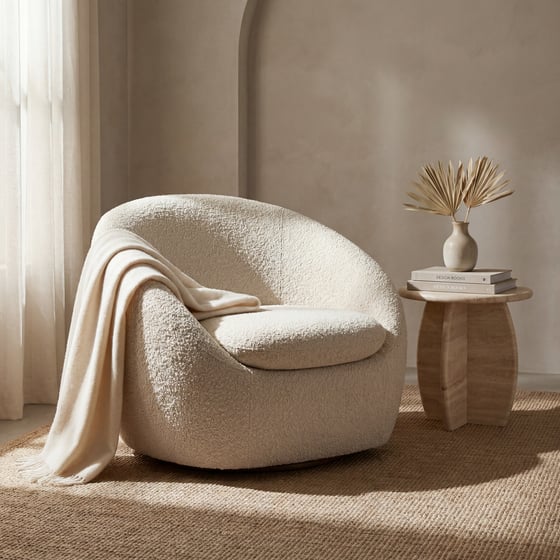 Bouclé cocoon accent chair in a quiet-luxury interior