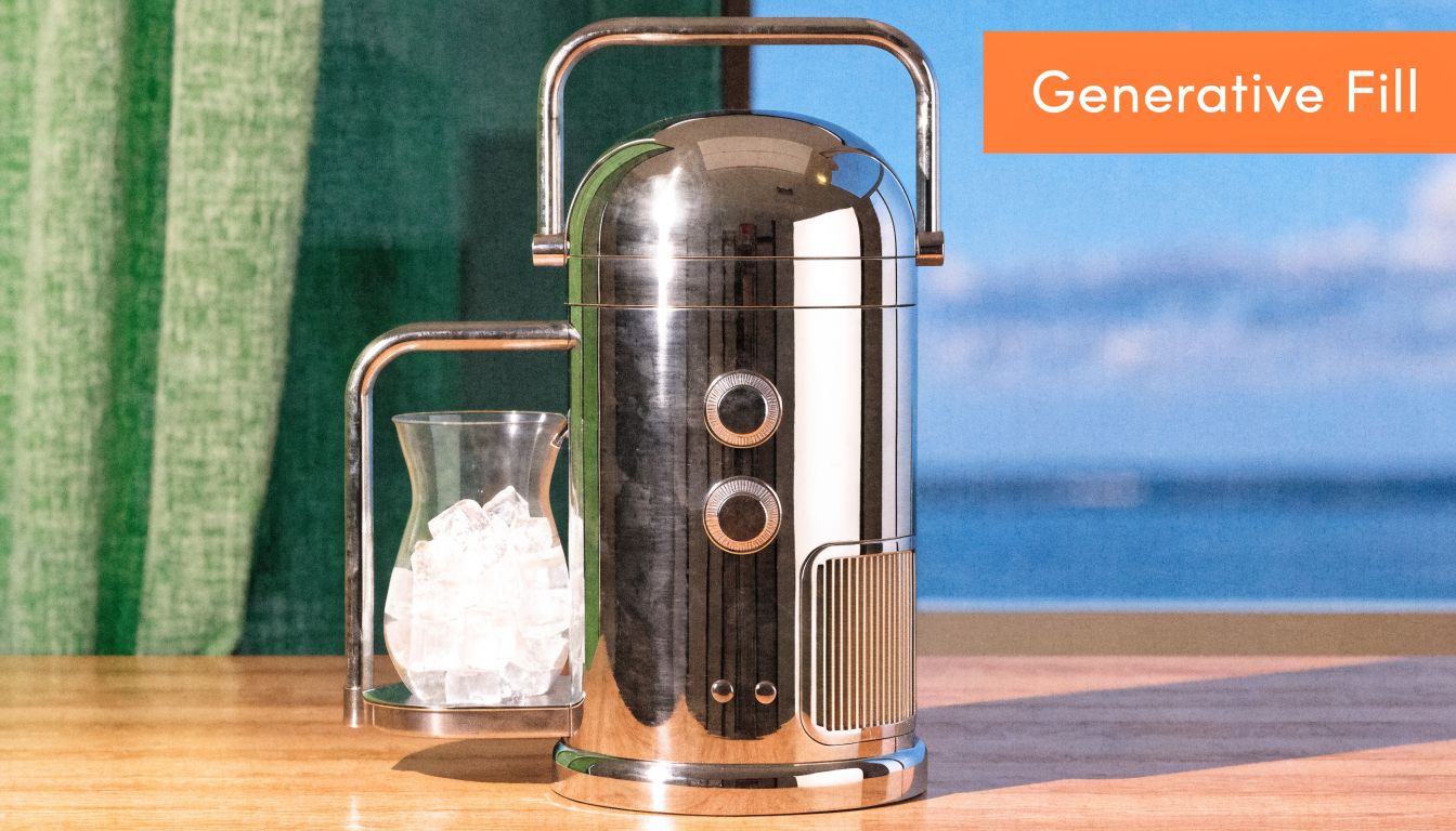 A modern chrome-finished beverage dispenser with a glass of ice sits on a wooden tabletop.