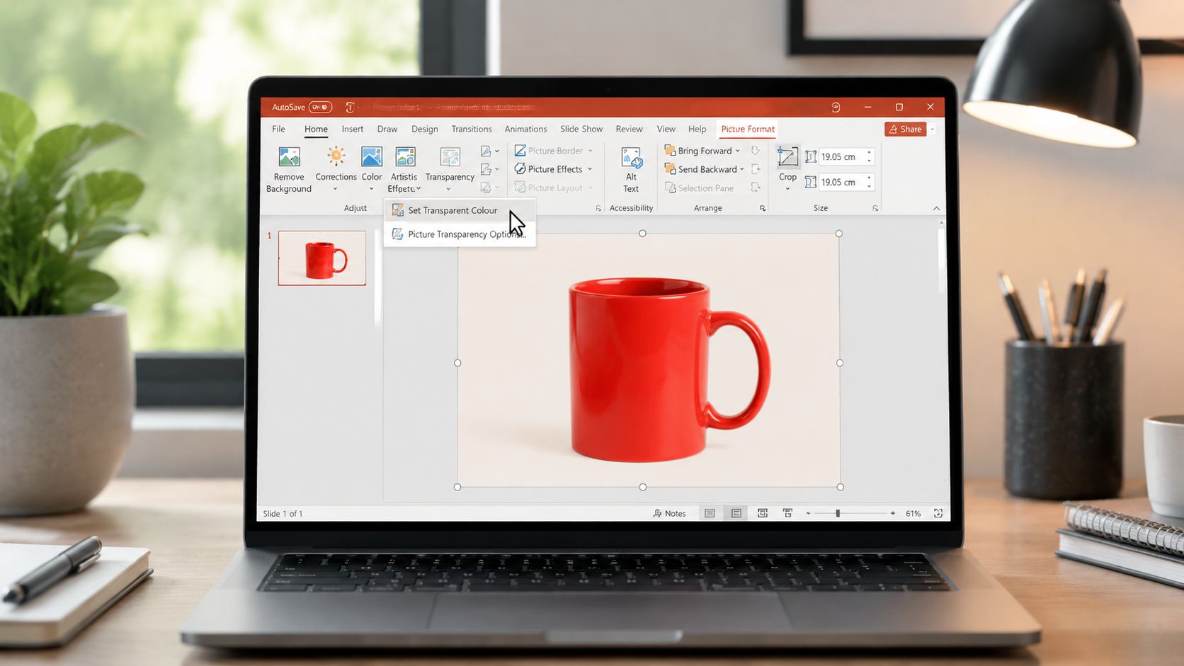 A laptop screen displaying the Microsoft PowerPoint interface with the Set Transparent Colour tool menu open.