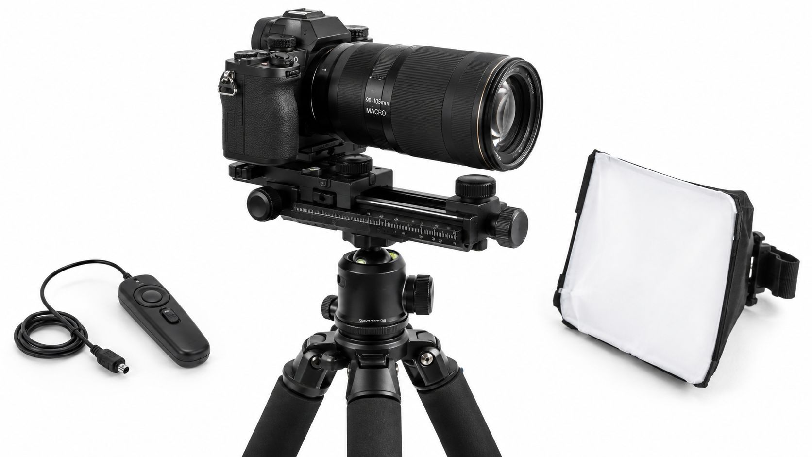 A professional camera set up on a tripod with a macro lens, remote trigger, and softbox lighting.