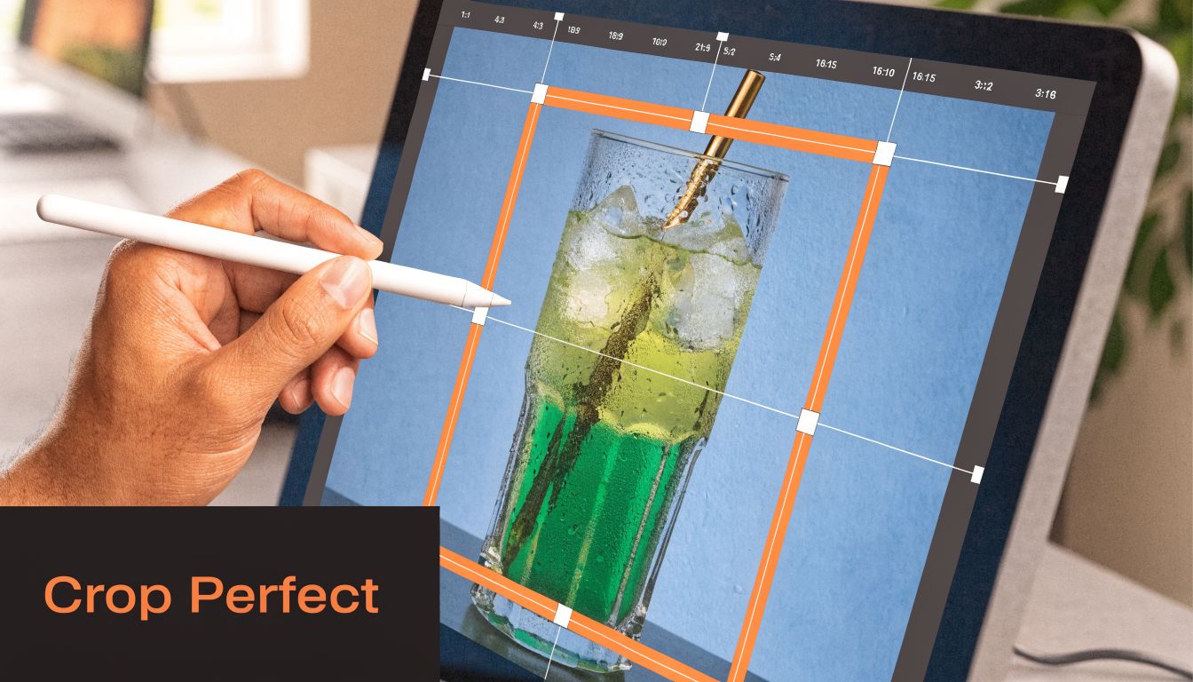 A person using a stylus to crop a glass drink image on a digital screen interface.