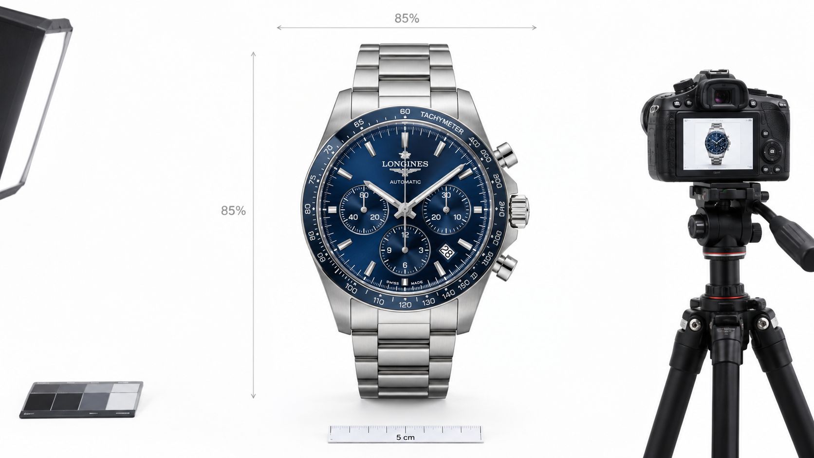 A professional product photography setup featuring a Longines watch on a white background with a camera.